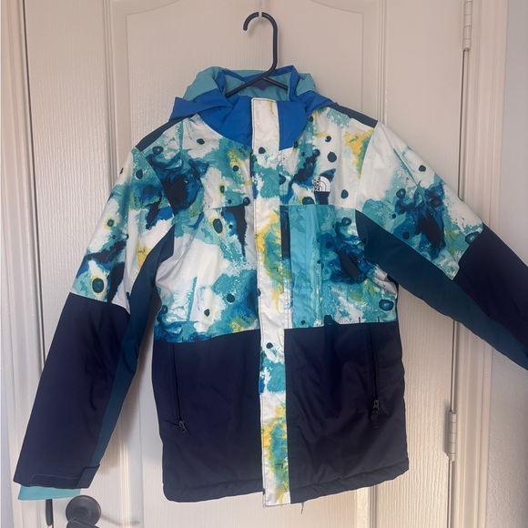 The North Face Kids Blue and White Puffer Jacket. Used about 10 days.